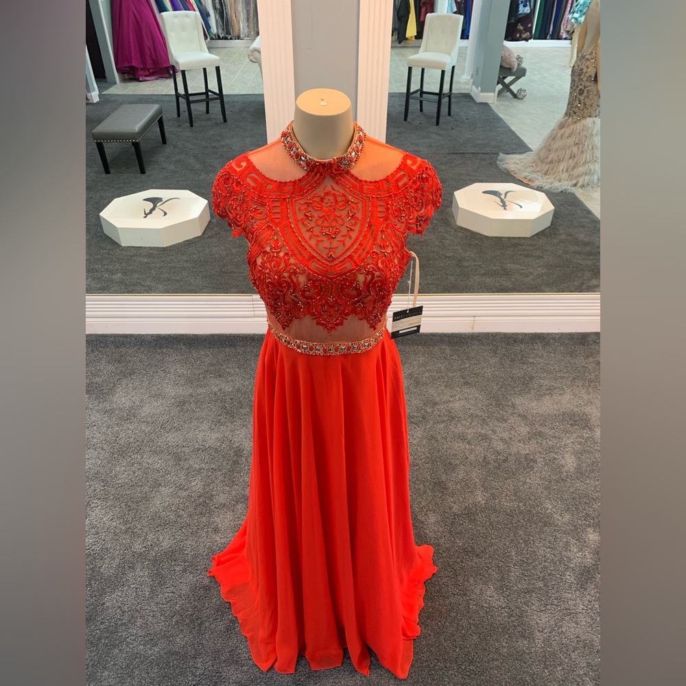 Size 4. Red. Classic. high neck. beaded top. a line. tulle bottom.